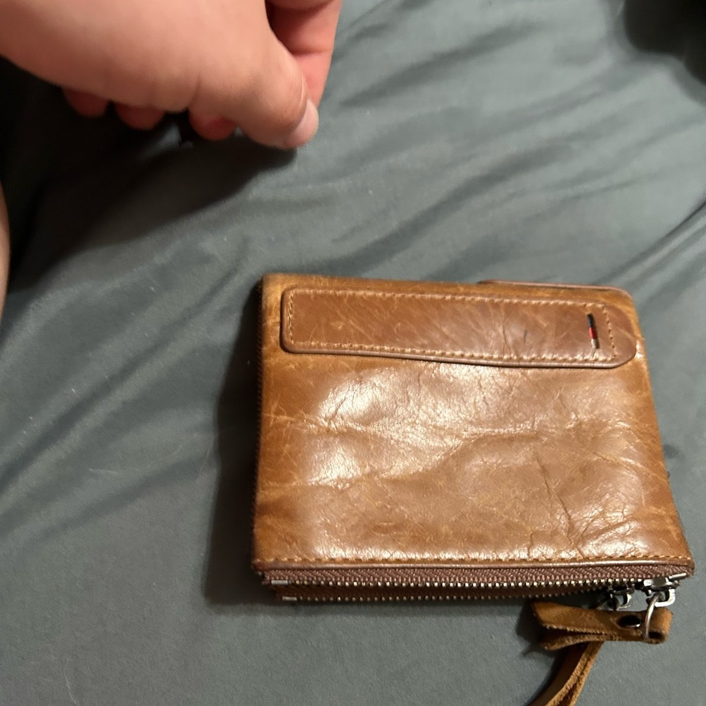 Brown wallet used but a lot of life left in it.